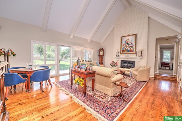 9706 Ascot Dr, Omaha, NE 68114 - living room with a fireplace, wood finished floors, beamed ceiling, and high vaulted ceiling