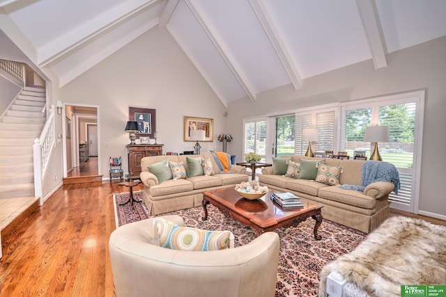 9706 Ascot Dr, Omaha, NE 68114 - living area with stairway, high vaulted ceiling, beamed ceiling, and light wood-style flooring