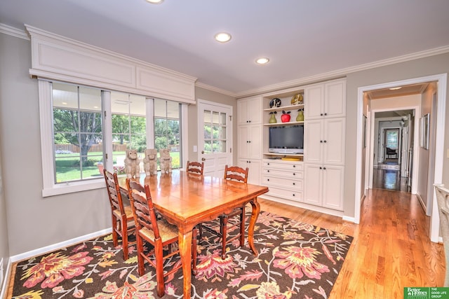 9706 Ascot Dr, Omaha, NE 68114 - dining space featuring light wood finished floors, crown molding, and recessed lighting