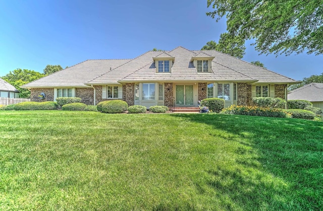 9706 Ascot Dr, Omaha, NE 68114 - view of front of property featuring brick siding, a front yard, and a tile roof