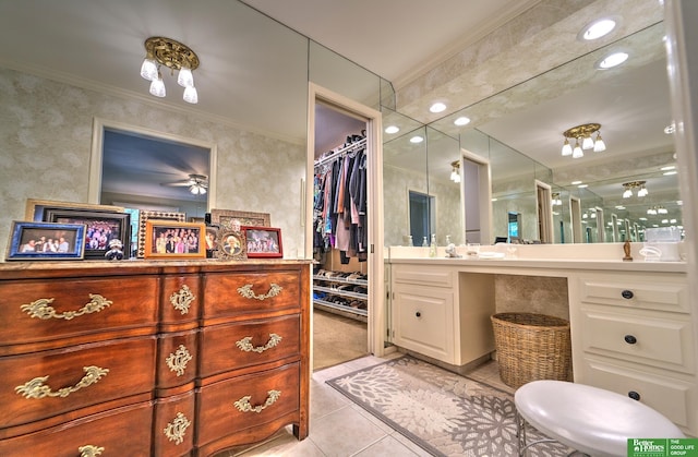 9706 Ascot Dr, Omaha, NE 68114 - full bathroom with tile patterned flooring, vanity, ornamental molding, a stall shower, and a walk in closet
