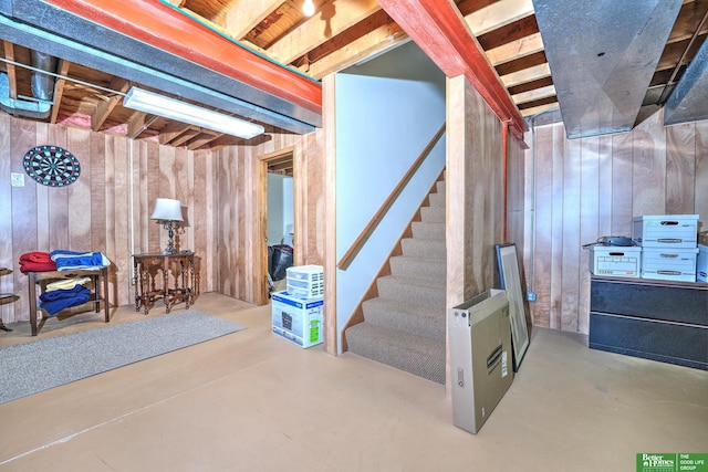 9706 Ascot Dr, Omaha, NE 68114 - unfinished basement featuring wooden walls and stairway