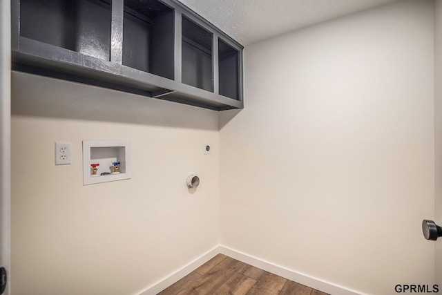 801 Redwood Ln, Papillion, NE 68046 - washroom featuring dark wood-style floors, washer hookup, hookup for an electric dryer, and a textured ceiling