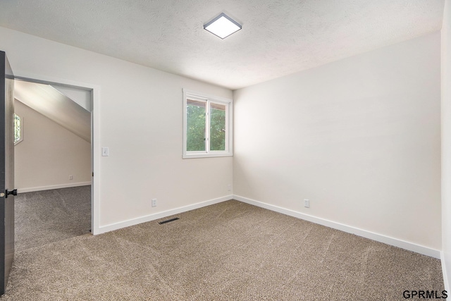 801 Redwood Ln, Papillion, NE 68046 - unfurnished room featuring carpet floors and a textured ceiling