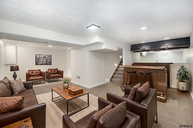 801 Redwood Ln, Papillion, NE 68046 - living area with stairway, carpet floors, and bar