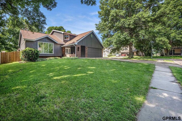 801 Redwood Ln, Papillion, NE 68046 - view of front of property with brick siding and a garage