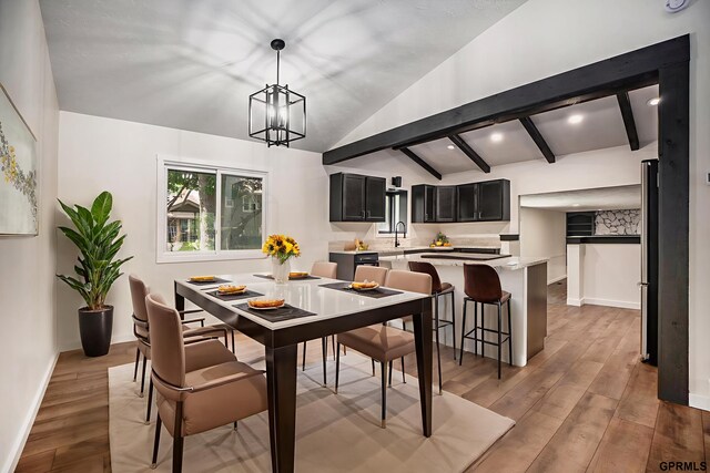 801 Redwood Ln, Papillion, NE 68046 - dining room with light wood-style flooring and a chandelier