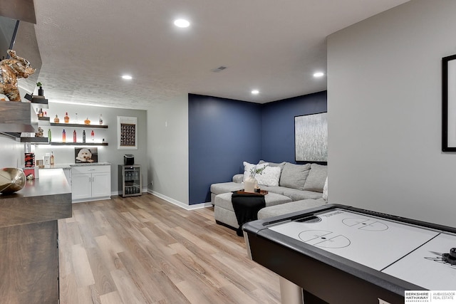 7163 N 164th St, Bennington, NE 68007 - living area featuring a dry bar, light wood finished floors, wine cooler, and recessed lighting