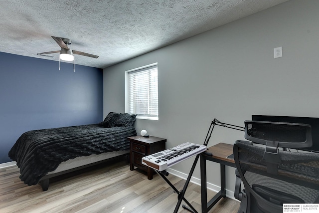 7163 N 164th St, Bennington, NE 68007 - bedroom featuring light wood-style floors, a ceiling fan, and a textured ceiling