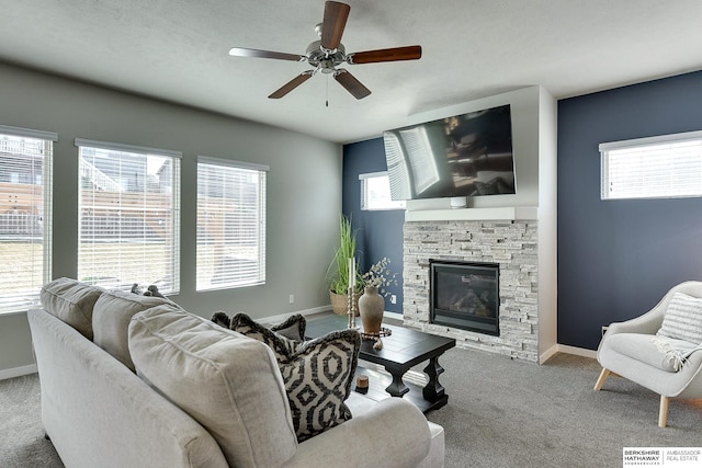 7163 N 164th St, Bennington, NE 68007 - living area featuring carpet flooring, ceiling fan, and a fireplace