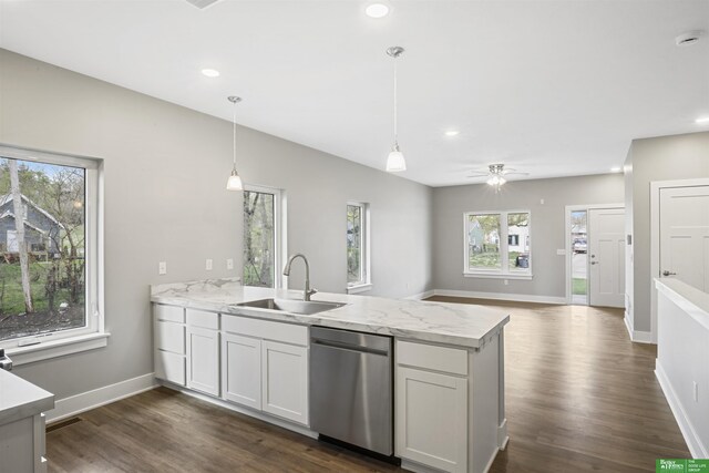 3941 Blondo St, Omaha, NE 68111 - kitchen featuring stainless steel dishwasher, a peninsula, dark wood-style flooring, hanging light fixtures, and open floor plan