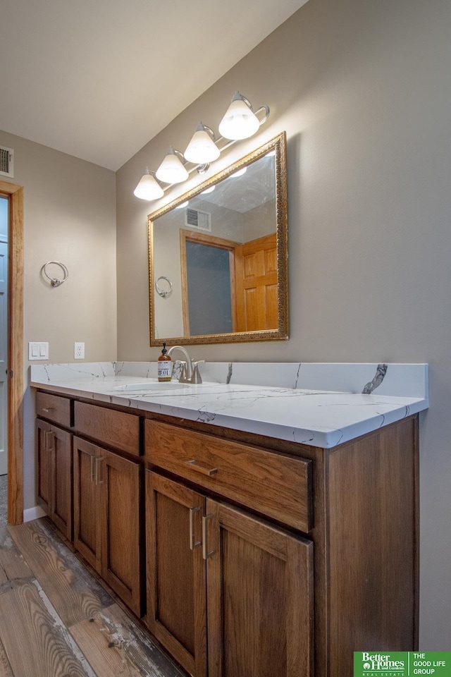 16712 Gold St, Omaha, NE 68130 - bathroom with vanity and wood finished floors