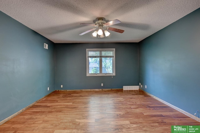 16712 Gold St, Omaha, NE 68130 - unfurnished room with a ceiling fan, wood finished floors, and a textured ceiling
