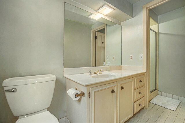 1729 S 76th Ave, Omaha, NE 68124 - full bathroom featuring vanity, tile patterned floors, and a shower with door