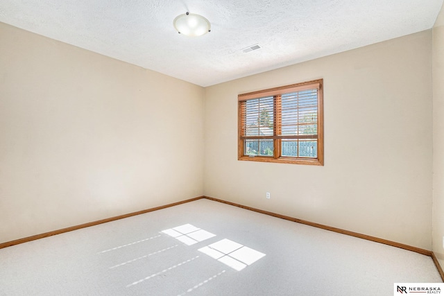 4209 N 158th Ave, Omaha, NE 68116 - carpeted spare room with baseboards and a textured ceiling