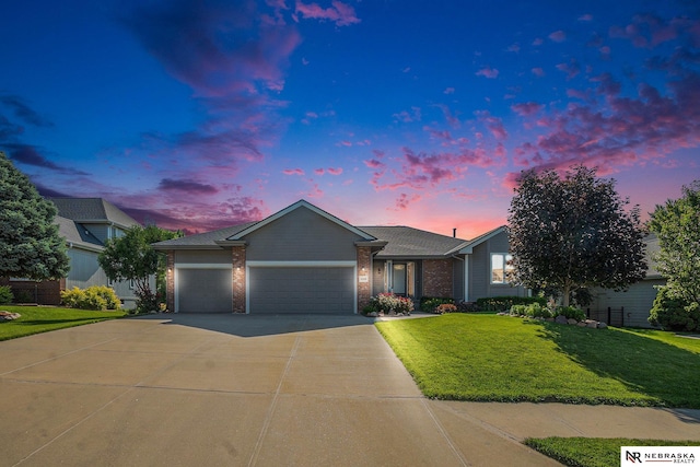 4209 N 158th Ave, Omaha, NE 68116 - single story home featuring an attached garage, driveway, a yard, and brick siding