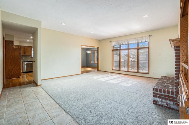 4209 N 158th Ave, Omaha, NE 68116 - unfurnished living room featuring light tile patterned flooring, light carpet, recessed lighting, and a fireplace