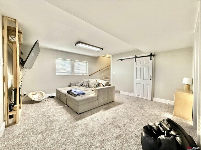 26855 SW 89th Rd, Beatrice, NE 68310 - carpeted living area featuring a barn door and baseboards