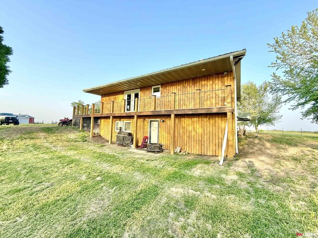 26855 SW 89th Rd, Beatrice, NE 68310 - rear view of property with a wooden deck and a yard