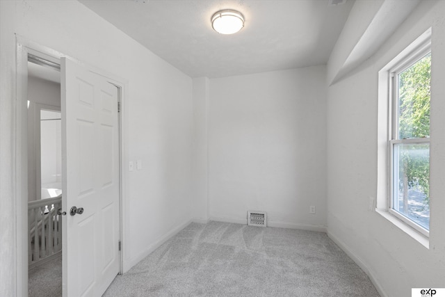 3102 Woolworth Ave, Omaha, NE 68105 - carpeted empty room with plenty of natural light