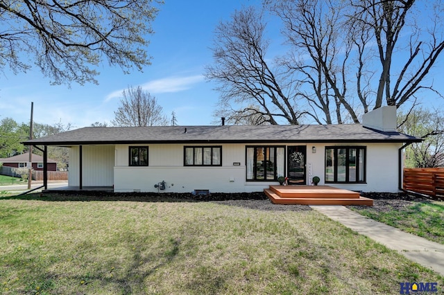 1991 Calvert St, Lincoln, NE 68502 - view of front facade with a deck and a chimney