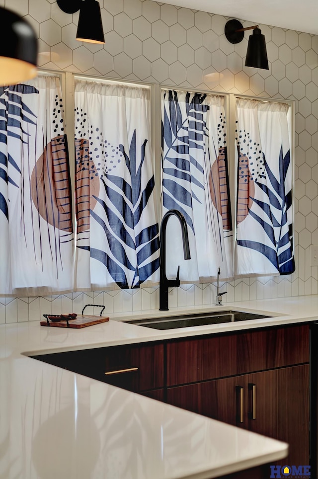 1991 Calvert St, Lincoln, NE 68502 - detailed view of light countertops, modern cabinets, and backsplash