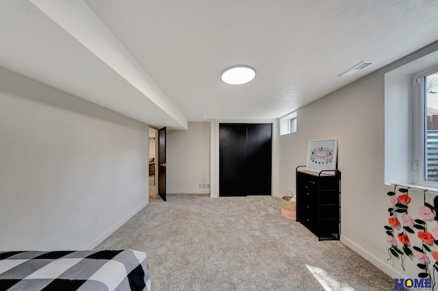 1991 Calvert St, Lincoln, NE 68502 - bedroom featuring carpet and multiple windows