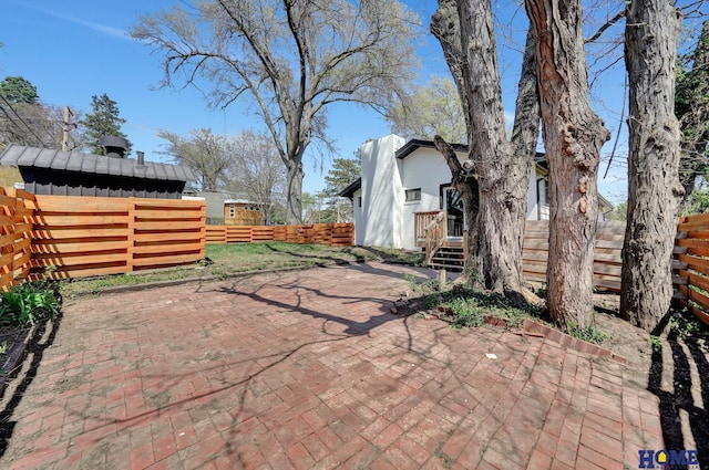1991 Calvert St, Lincoln, NE 68502 - fenced backyard with a patio