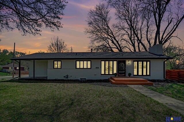 1991 Calvert St, Lincoln, NE 68502 - back of property at dusk featuring a chimney