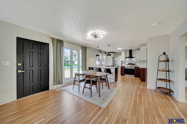 1991 Calvert St, Lincoln, NE 68502 - dining area featuring light wood-style flooring and baseboards