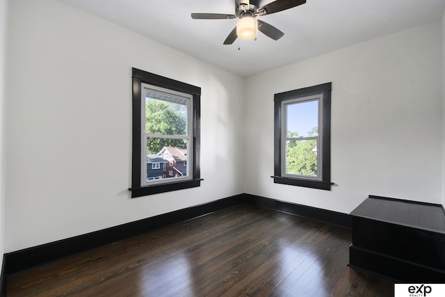 3814 Marcy St, Omaha, NE 68105 - empty room with plenty of natural light, dark wood-style flooring, and a ceiling fan