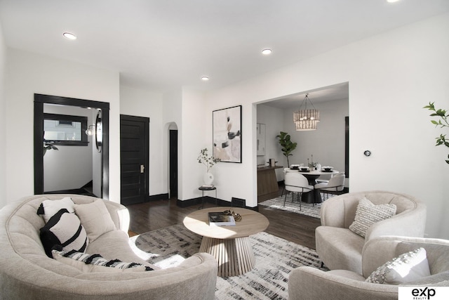 3814 Marcy St, Omaha, NE 68105 - living area with wood finished floors, a chandelier, arched walkways, and recessed lighting