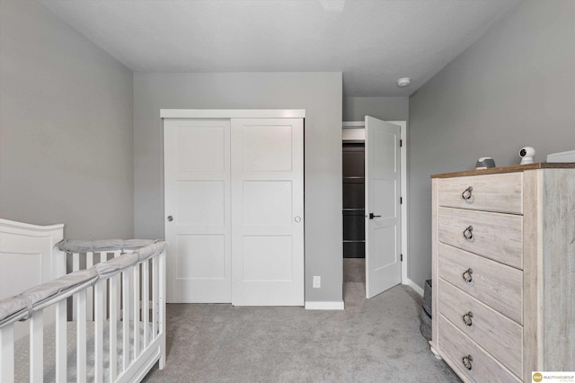 7176 N 166th St, Bennington, NE 68007 - bedroom featuring light carpet, a closet, and a nursery area