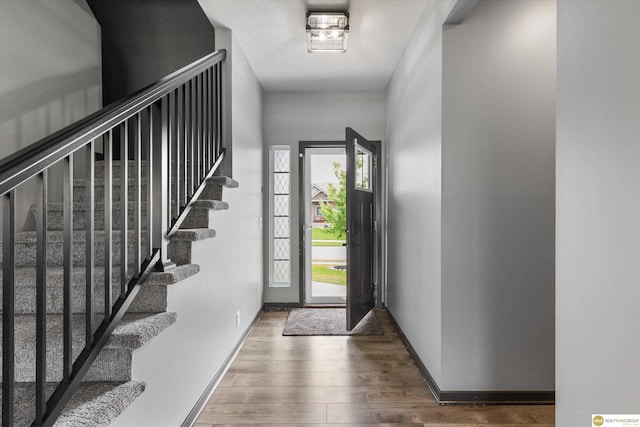 7176 N 166th St, Bennington, NE 68007 - entrance foyer featuring plenty of natural light, wood finished floors, and stairway