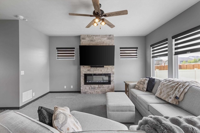 7176 N 166th St, Bennington, NE 68007 - carpeted living room with ceiling fan and a fireplace
