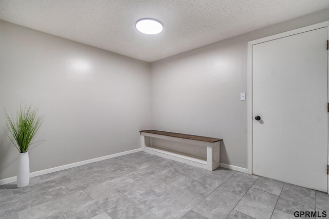 4005 N 213th Cir, Omaha, NE 68022 - unfurnished room featuring a textured ceiling and baseboards