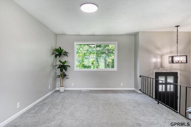 4005 N 213th Cir, Omaha, NE 68022 - empty room with a chandelier and carpet