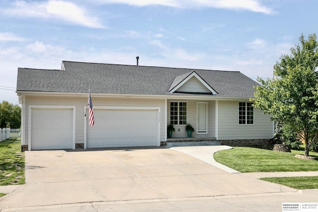 21305 Mcclellan Cir, Gretna, NE 68028 - view of front of home with a garage, driveway, a shingled roof, and a front yard