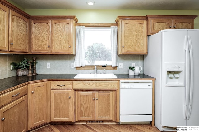 21305 Mcclellan Cir, Gretna, NE 68028 - kitchen with white appliances, dark countertops, light wood finished floors, and recessed lighting