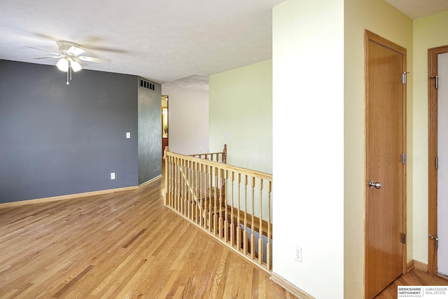 21305 Mcclellan Cir, Gretna, NE 68028 - hallway featuring an upstairs landing and wood finished floors