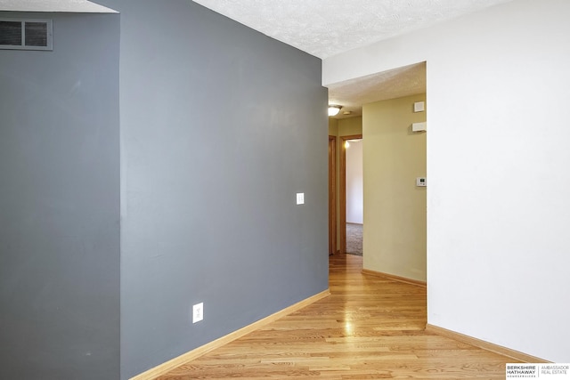 21305 Mcclellan Cir, Gretna, NE 68028 - hall featuring a textured ceiling and light wood finished floors