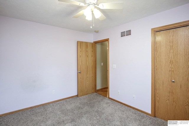 21305 Mcclellan Cir, Gretna, NE 68028 - unfurnished bedroom with carpet flooring, a closet, and a ceiling fan
