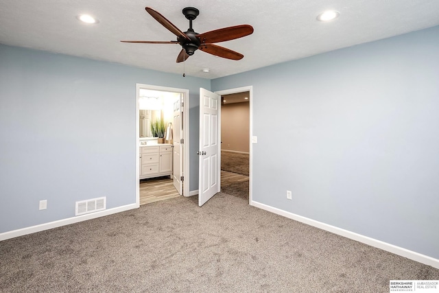 21305 Mcclellan Cir, Gretna, NE 68028 - unfurnished bedroom featuring light carpet, recessed lighting, connected bathroom, and ceiling fan