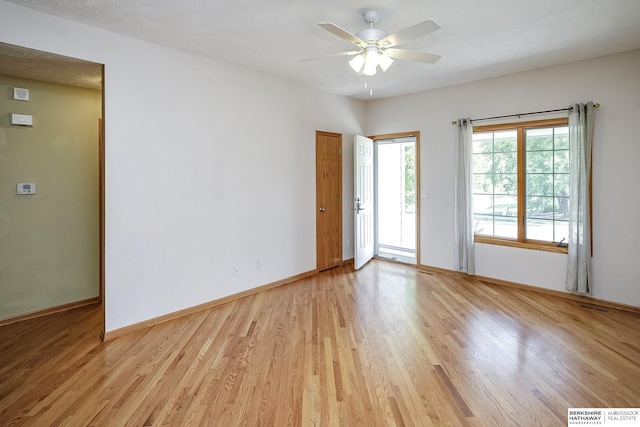 21305 Mcclellan Cir, Gretna, NE 68028 - empty room with ceiling fan and light wood-style flooring
