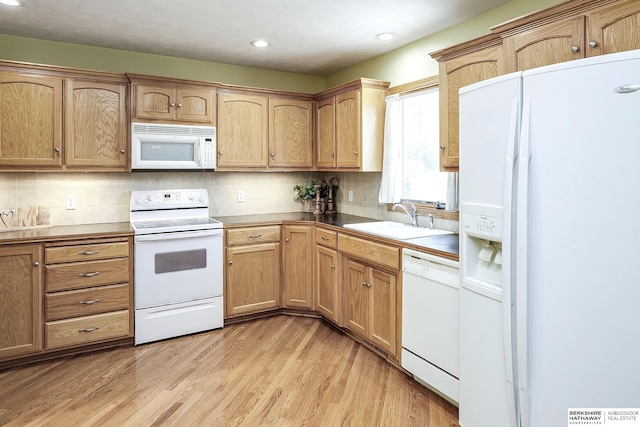 21305 Mcclellan Cir, Gretna, NE 68028 - kitchen with white appliances, light wood-style floors, backsplash, and recessed lighting