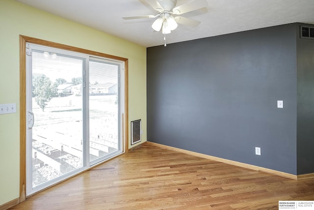 21305 Mcclellan Cir, Gretna, NE 68028 - empty room with a ceiling fan and light wood finished floors