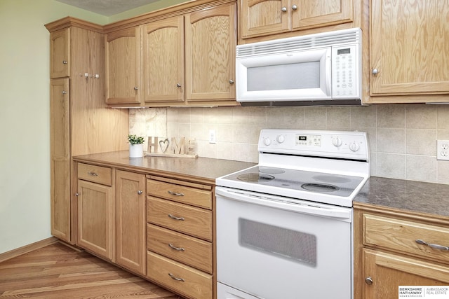 21305 Mcclellan Cir, Gretna, NE 68028 - kitchen with white appliances, backsplash, light wood-style floors, dark countertops, and light brown cabinetry