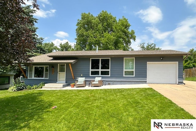 8506 Keystone Dr, Omaha, NE 68134 - view of front facade with concrete driveway, a garage, and roof with shingles