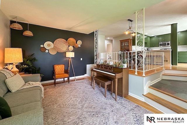 8506 Keystone Dr, Omaha, NE 68134 - living area featuring baseboards and wood finished floors