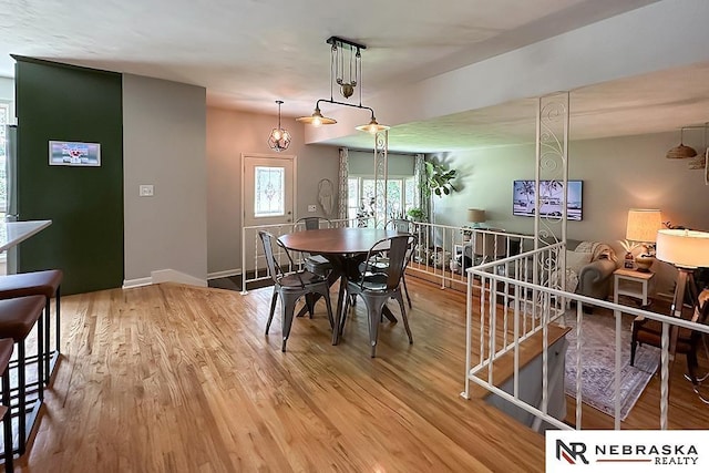 8506 Keystone Dr, Omaha, NE 68134 - dining space with light wood-type flooring and baseboards